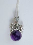 A silver and amethyst ball necklace poss