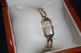 A ladies 9ct gold & diamond wristwatch b