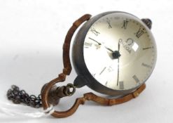 A brass ball clock