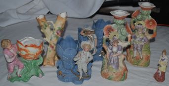 A collection of porcelain figurine vases