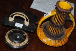 A selection of ebonised wooden items and vase