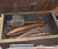 An antique tool box with tools