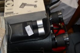 Two pairs of binoculars in cases