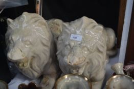 A pair of large ceramic lions