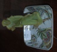 An Oriental jade statue of a monk with an Oriental tray