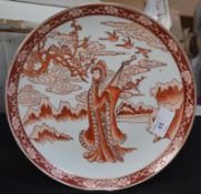 An oriental plate depicting a maiden playing a lute