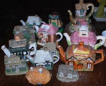 A collection of teapots in the form of houses ,cottages and lighthouse