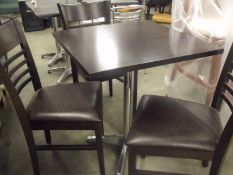 3 x walnut chairs with brown faux seat pads
1 x single pedestal table with solid wood