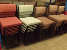 66 x used steel framed stacking conference chairs in various colours