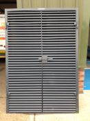 Steel louver doors and frame (un used) comes with furnishings but key missing for lock.