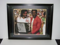 Signed Picture with Pele And Best. Framed and supplied with certificate of authenticity. Size in