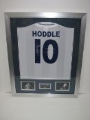 Signed football shirt 'Glenn Hoddle'. Supplied in a frame and with certificate of authenticity. Size