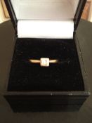 9ct gold ring with a single square diamond