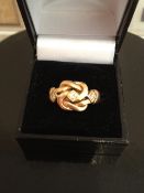 18kt yellow gold and diamonds knot ring. very heavy, 9.6g weight