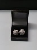 A stunning pair of 9K White Gold Earrings with 86 Cut Diamonds giving 0.640ct.