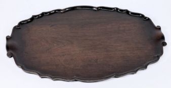 A Georgian mahogany piecrust tray: of ov