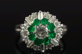 An emerald and diamond circular cluster