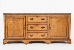 An early 19th Century oak and chequer in