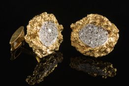 A pair of diamond mounted cuff-links: wi