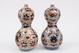 A pair of Japanese Imari porcelain vases