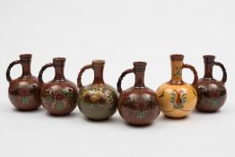 Six Watcombe (Torquay) pottery ewers: of
