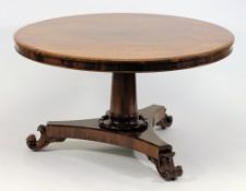 A Victorian rosewood circular dining tab