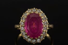A pink tourmaline and diamond oval clust