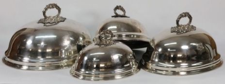 A set of four graduated silver plated do