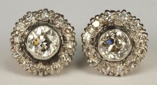 A pair of diamond mounted circular clust