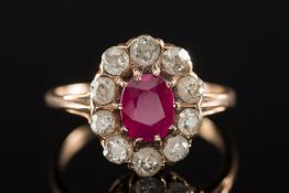 A ruby and diamond oval cluster ring:, t