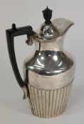 A late Victorian silver hot water jug, m