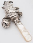A George V silver rattle, maker's mark w