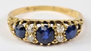 A gold, sapphire and diamond seven stone