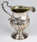 A George III silver pedestal cream jug,