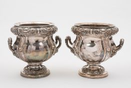 A pair of Edwardian silver plated wine c