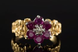 A ruby and diamond cluster ring: with ce