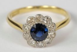 An 18ct gold, sapphire and diamond circu