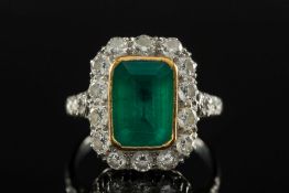 An emerald and diamond rectangular clust