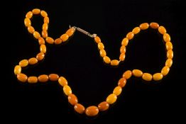 A graduated amber bead single string nec