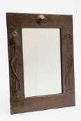 An Arts and Craft beaten copper wall mir