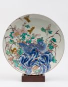 An Arita porcelain charger: painted in u