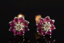 A pair of ruby and diamond circular ear