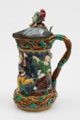 A Minton majolica jester jug:, the pewte