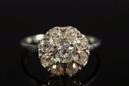 A diamond mounted circular cluster ring:
