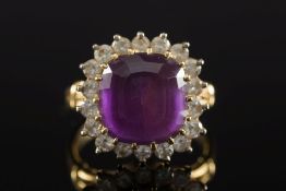 An amethyst and diamond cushion-shaped c