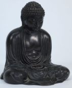 A Japanese bronze figure of Buddha: sitt