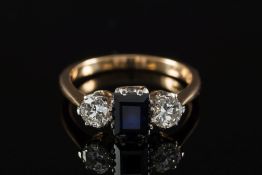 A sapphire and diamond three-stone ring: