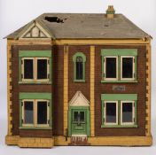 A large early 20th century dolls house,