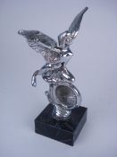 A 1930's mascot in the form of a winged