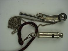 A silver plated Bosun's whistle and a 19